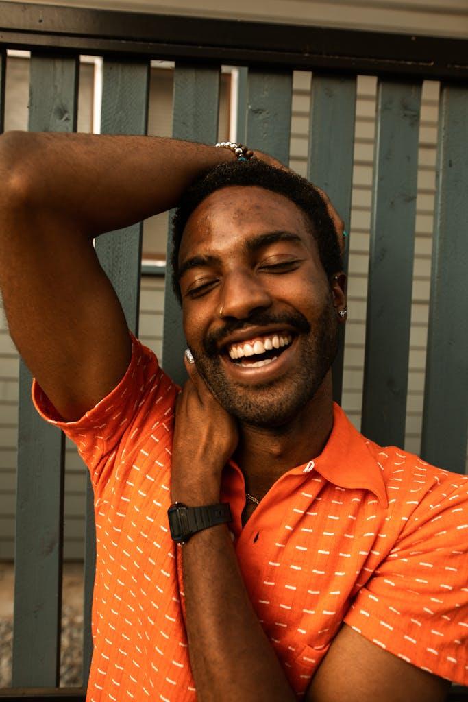 Man in Red Polo Shirt Smiling